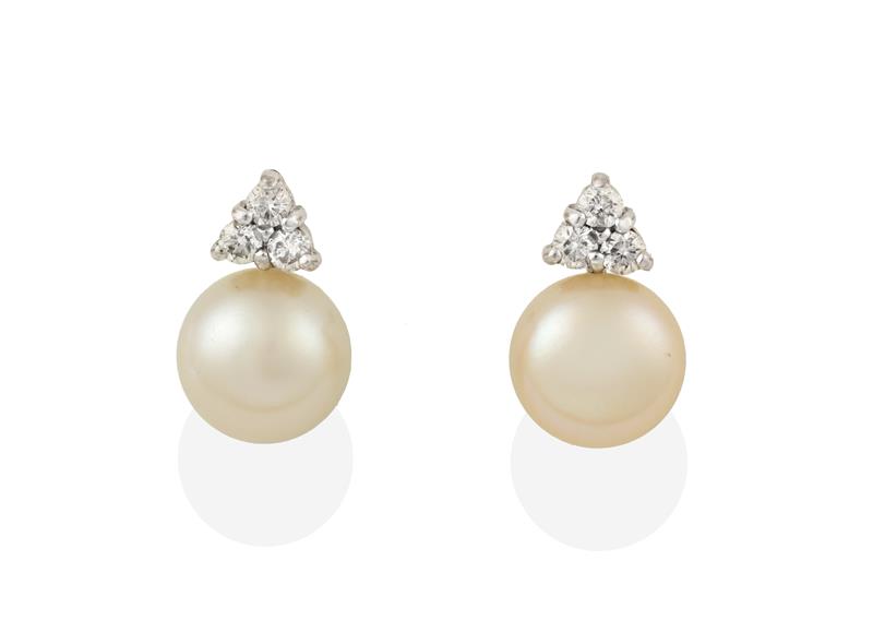 A Pair of 18 Carat White Gold Cultured Pearl and Diamond Earrings, the cultured pearl surmounted