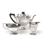 A Three-Piece Victorian Silver Tea-Service, by Hawksworth, Eyre and Co. Ltd., London, 1896, each