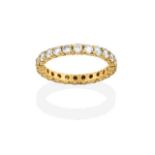 A Diamond Eternity Ring, by Cartier, the round brilliant cut diamonds in yellow claw settings, total