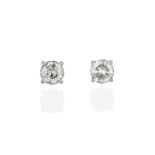 A Pair of Diamond Solitaire Earrings, the round brilliant cut diamonds in white four claw