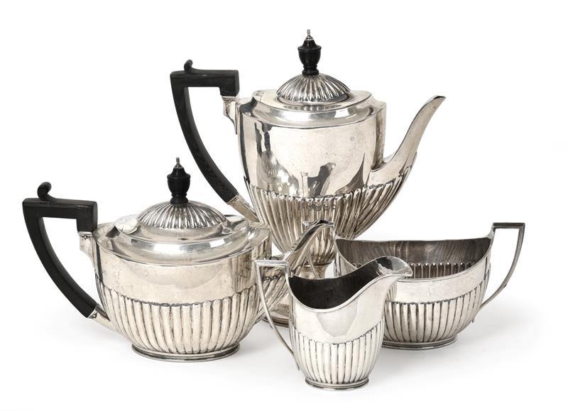 A Four-Piece Victorian Silver Tea and Coffee-Service, by Walter and John Barnard, London, 1890 and