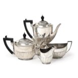 A Four-Piece Victorian Silver Tea and Coffee-Service, by Walter and John Barnard, London, 1890 and