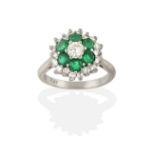 An Emerald and Diamond Cluster Ring, the round brilliant cut diamond within a border of round cut