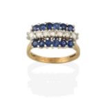 A 9 Carat Gold Sapphire and Diamond Ring, a row of round brilliant cut diamonds flanked by rows of