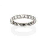 A Diamond Eternity Ring, the round brilliant cut diamonds in white claw and channel settings,