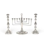 A George V Silver Hanukkah Menorah and a Pair of Sabbath Candlesticks, the Menorah by Britton, Gould