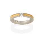 A Diamond Solitaire Ring, the round brilliant cut diamond tension set between a band formed of