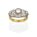 A Diamond Cluster Ring, a round brilliant cut diamond to an openwork border set throughout with