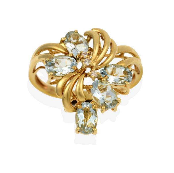 A 9 Carat Gold Aquamarine Ring, the floral motif set throughout with oval cut aquamarines and