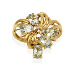 A 9 Carat Gold Aquamarine Ring, the floral motif set throughout with oval cut aquamarines and
