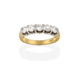 An 18 Carat Gold Diamond Five Stone Ring, the round brilliant cut diamonds spaced by white plain