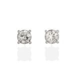 A Pair of Diamond Solitaire Earrings, the round brilliant cut diamonds in white four claw