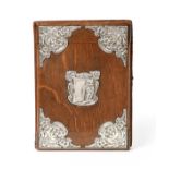 An Edward VII Silver-Mounted Oak Desk-Blotter, by J. Aitkin and Son, Birmingham, 1905, oblong, the