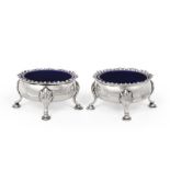 A Pair of George III Silver Salt-Cellars, by David and Robert Hennell, London, 1766, each bombé oval