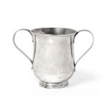 A George III Silver Two-Handled Cup, by James Young, London, 1783, baluster and on spreading foot,
