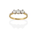 A Diamond Three Stone Ring, the graduated round brilliant cut diamonds in white double claw