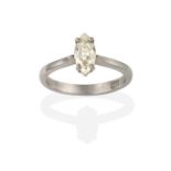 A Diamond Solitaire Ring, the marquise cut diamond in a white claw setting, to a tapered shoulder