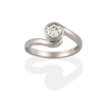 An 18 Carat White Gold Diamond Solitaire Ring, the round brilliant cut diamond in a rubbed over