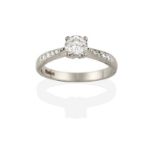 A Platinum Diamond Solitaire Ring, the round brilliant cut diamond in a four claw setting, to a