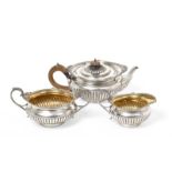 A Three-Piece Victorian Silver Tea-Service, by Walter and John Barnard, London, 1891, each piece