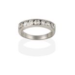 An 18 Carat White Gold Diamond Half Hoop Ring, the round brilliant cut diamonds in channel settings,