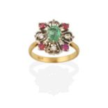 An Emerald, Ruby and Diamond Ring, the oval cut emerald in a yellow claw setting, within a white