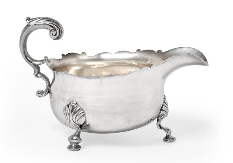 A George II Silver Sauceboat, Maker's Mark Worn, London, 1747, bombé and on three shell-capped
