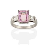 A Kunzite and Diamond Ring, the emerald-cut kunzite flanked by pairs of tapered baguette cut