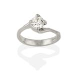 A Platinum Diamond Solitaire Ring, the round brilliant cut diamond in a four claw setting, to a