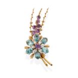 A 9 Carat Gold Blue Zircon, Amethyst and Diamond Brooch, the floral spray motif set throughout