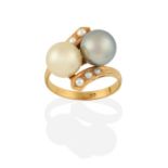 A Cultured Pearl Twist Ring, two cultured pearls diagonally set, to split pearl set twist shoulders,