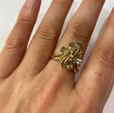 A 9 Carat Gold Aquamarine Ring, the floral motif set throughout with oval cut aquamarines and - Image 8 of 8