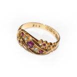 An 18 carat gold ruby and diamond ring, finger size L. Gross weight 2.6 grams.