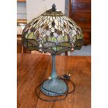 A Tiffany style table lamp, the shade decorated with dragon flies and cabouchons, 61cm . (in good