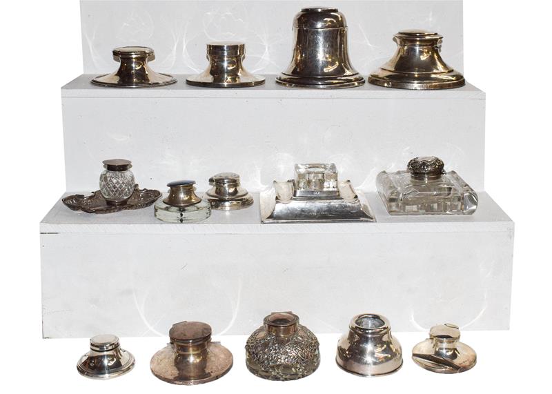 A collection of assorted inkwells, mostly of capstan form (one tray)