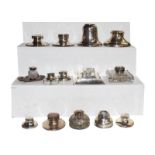 A collection of assorted inkwells, mostly of capstan form (one tray)