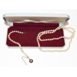 A cultured pearl necklace, length 62cm; and a cultured pearl bracelet knotted to a 9 carat gold
