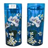 A pair of French blue glass vases, of cylindrical form, with enamelled floral decoration,