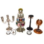 Metal two tier bobbin stand, plated candelabrum, ebonised wig stand, combined watch stand and pin