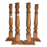 A set of four tall treen candlesticks (from a Masonic lodge)