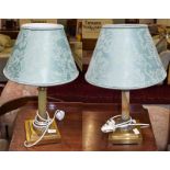 A pair of brass and onyx table lamps, with silk shades and stepped bases, together with a