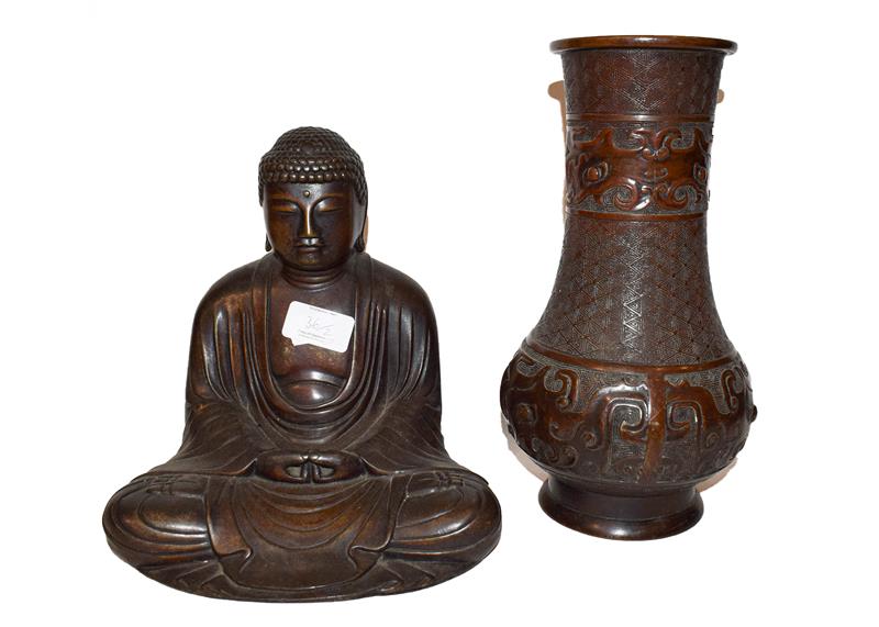 A Chinese bronze statue of a seated Buddha, together with a Japanese bronze vase after a Chinese