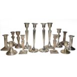 A collection of assorted silver candlesticks, (a.f), filled (one tray)