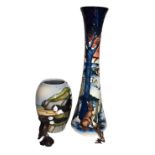 A modern moorcroft vase of slender form by Nicola Stanley decorated with hares in a winter
