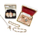 Five charms/pendants hung on a 9 carat gold chain; a Wedgwood brooch; a cameo brooch stamped '