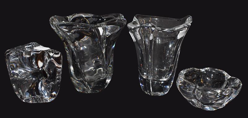 Four pieces of modern Daum clear crystal glass, comprising two vases, an abstract candle holder