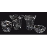 Four pieces of modern Daum clear crystal glass, comprising two vases, an abstract candle holder