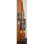 An Eastern painted and carved wooden figure in traditional dress, possibly Cambodian 190cm tall,