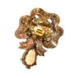 A citrine brooch with a central drop, unmarked, measures 3.4cm by 5.3cm . Gross weight 8.3 grams.