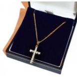 An 18 carat gold diamond cross pendant on an 18 carat gold chain, pendant length 2.6cm, chain length